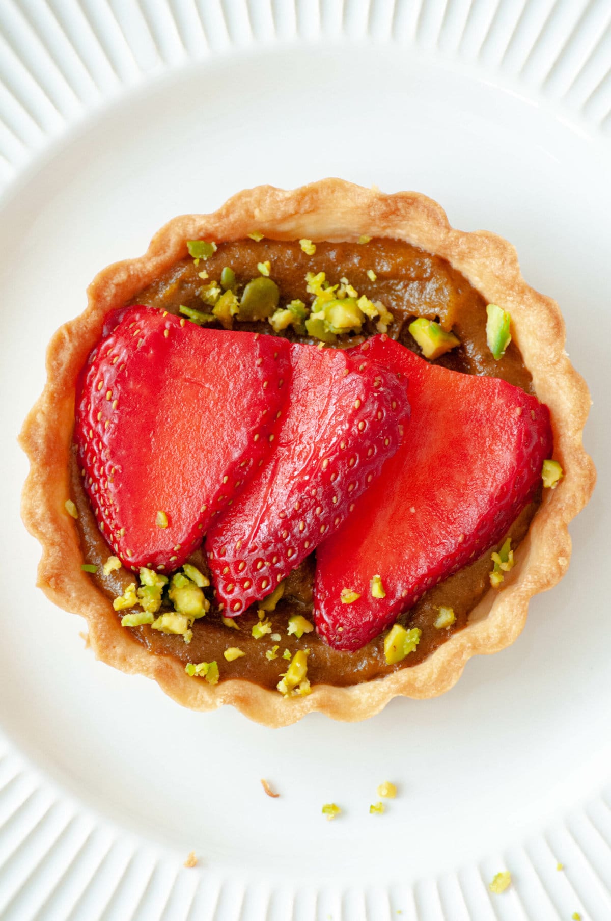 Zoom in on one of our strawberry pistachio tarts.