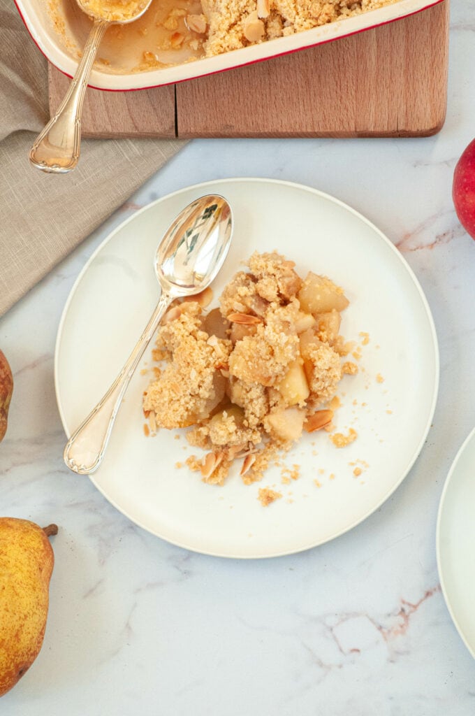 Spread crumble on a plate with a fork.