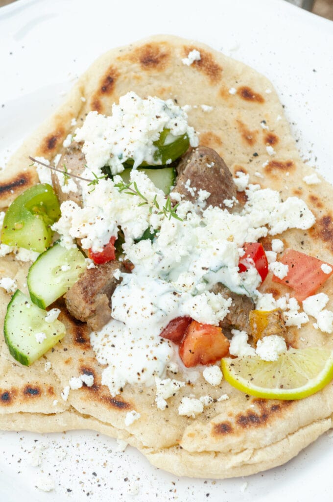 Gyros with tomatoes, feta, pork, cucumber and herbs.