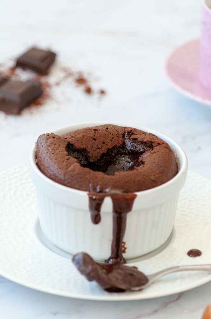 Chocolate soufflé overflowing with runny chocolate.