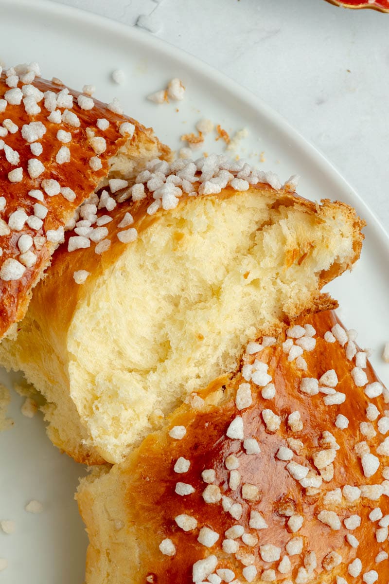A piece of brioche des rois, where you can see the inside of the brioche with the super-spun crumb.