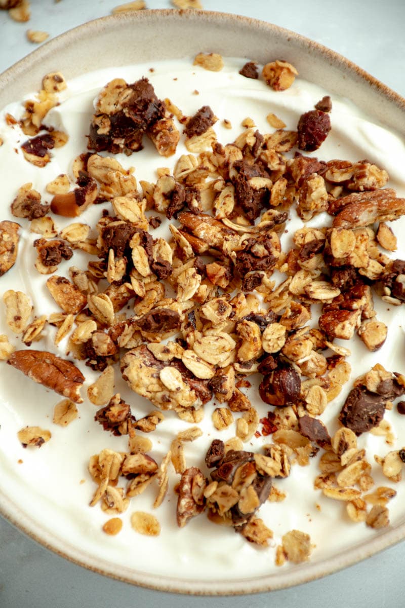 Granola in a bowl of fromage frais.