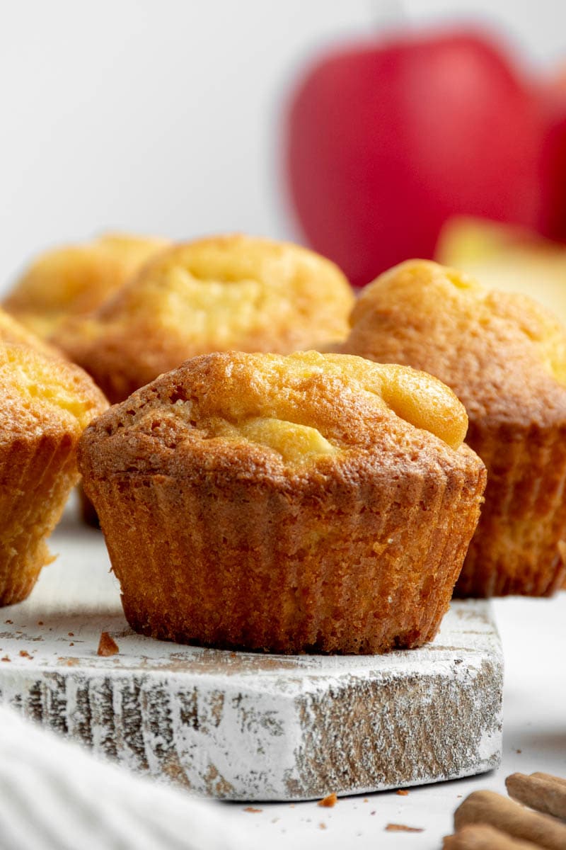 Apple muffins on a board.