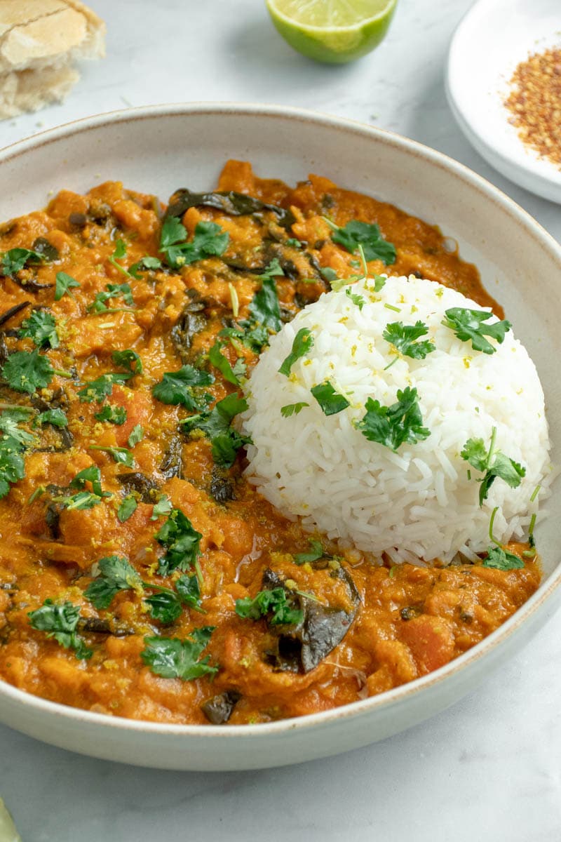 Vegetable curry on a plate with rice.