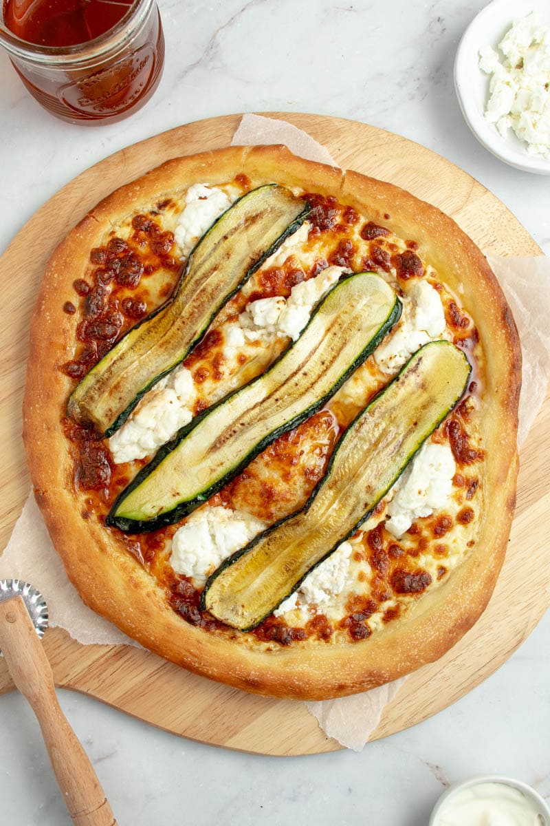 Honey-goat pizza with grilled zucchini strips.