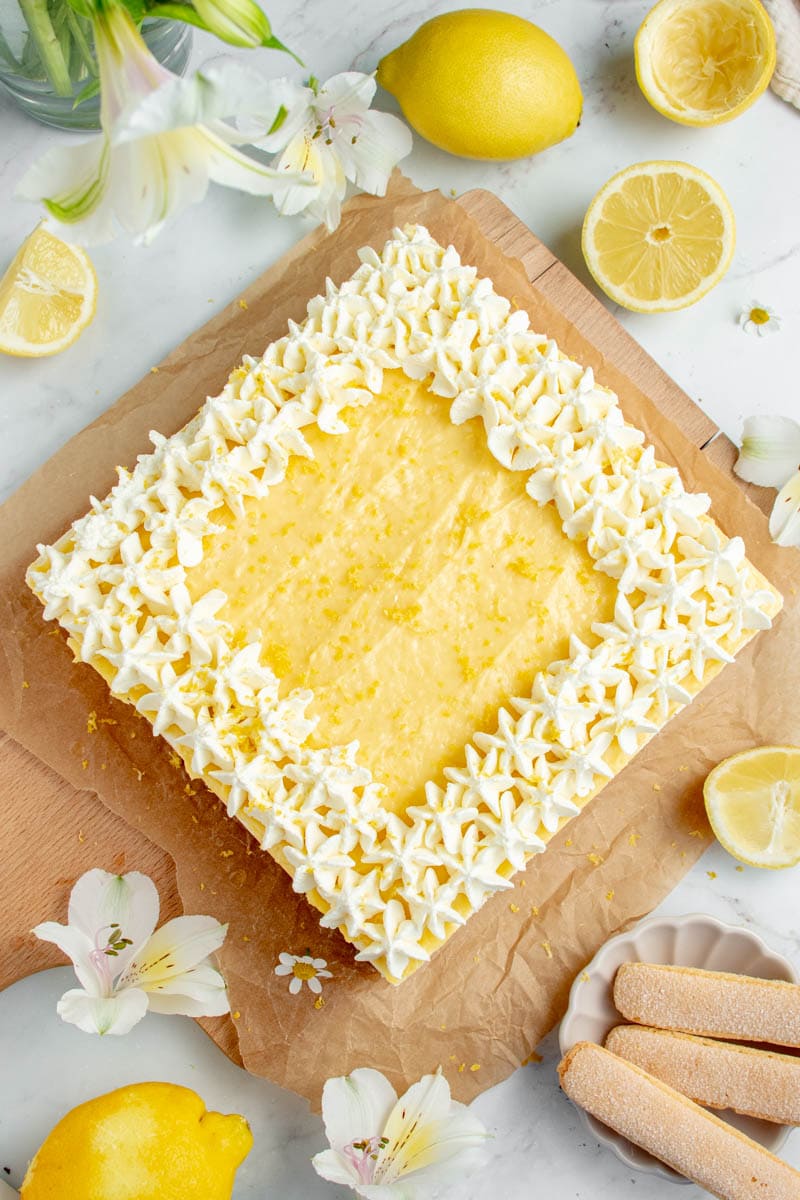 Lemon tiramisu on a sheet of baking paper.