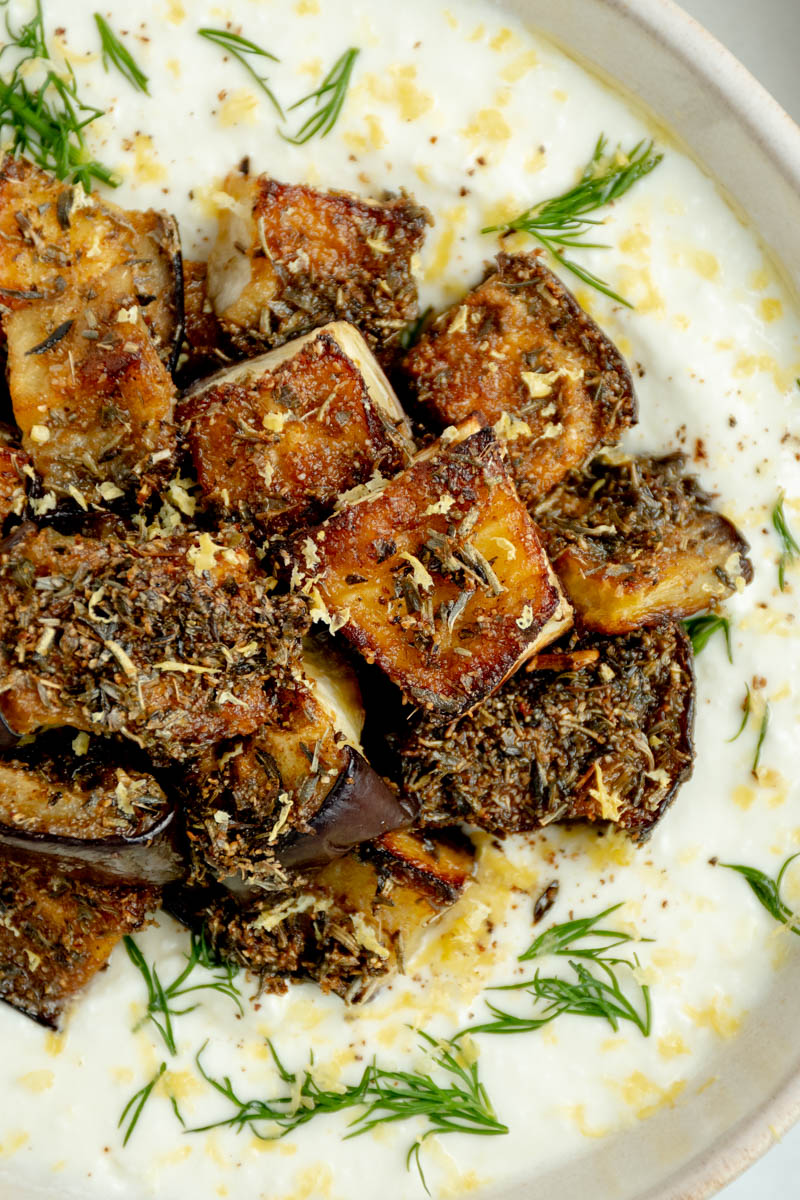 Zoom in on the eggplant cubes on top of the feta cream.