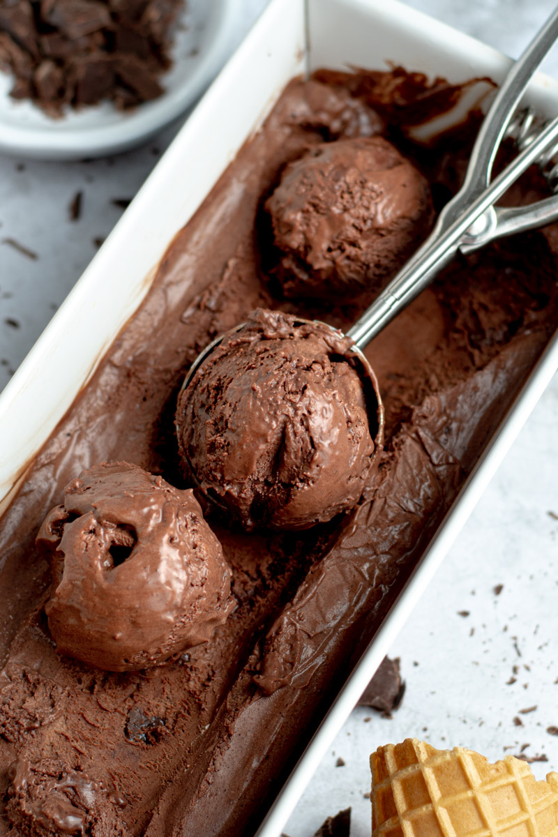 Scoops of chocolate ice cream in their mold.