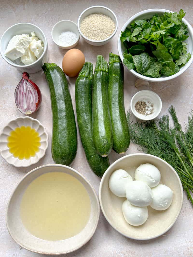 All the ingredients for zucchini croquettes with mozzarella filling.