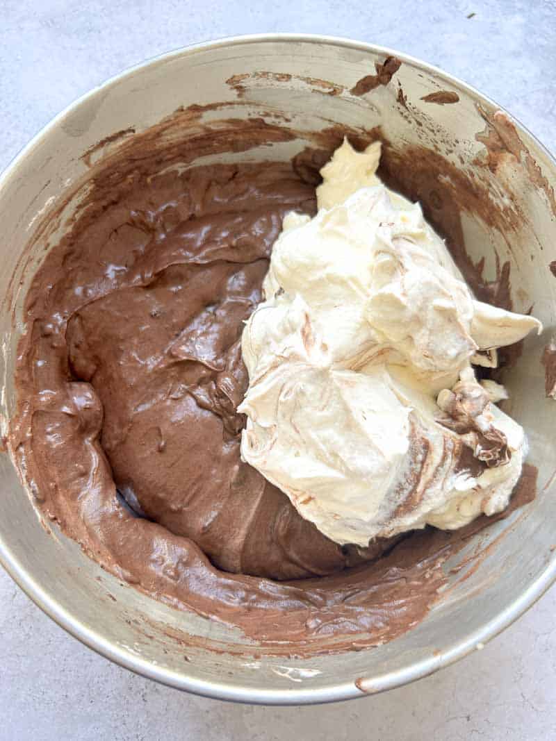 Add the remaining whipped cream to the chocolate bowl.
