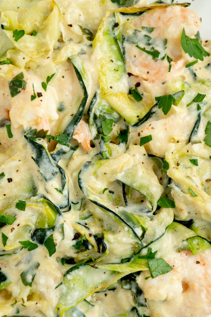Focus on zucchini tagliatelle and shrimps.