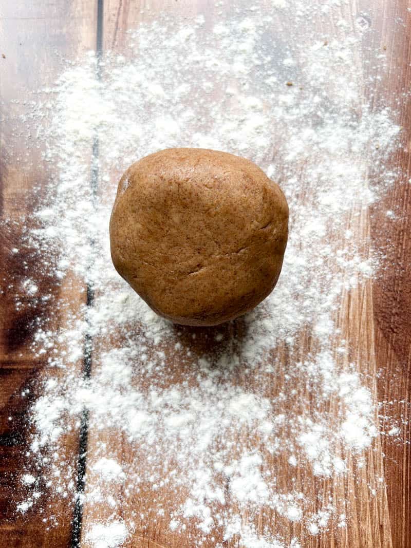 Ball of dough on a floured work surface.