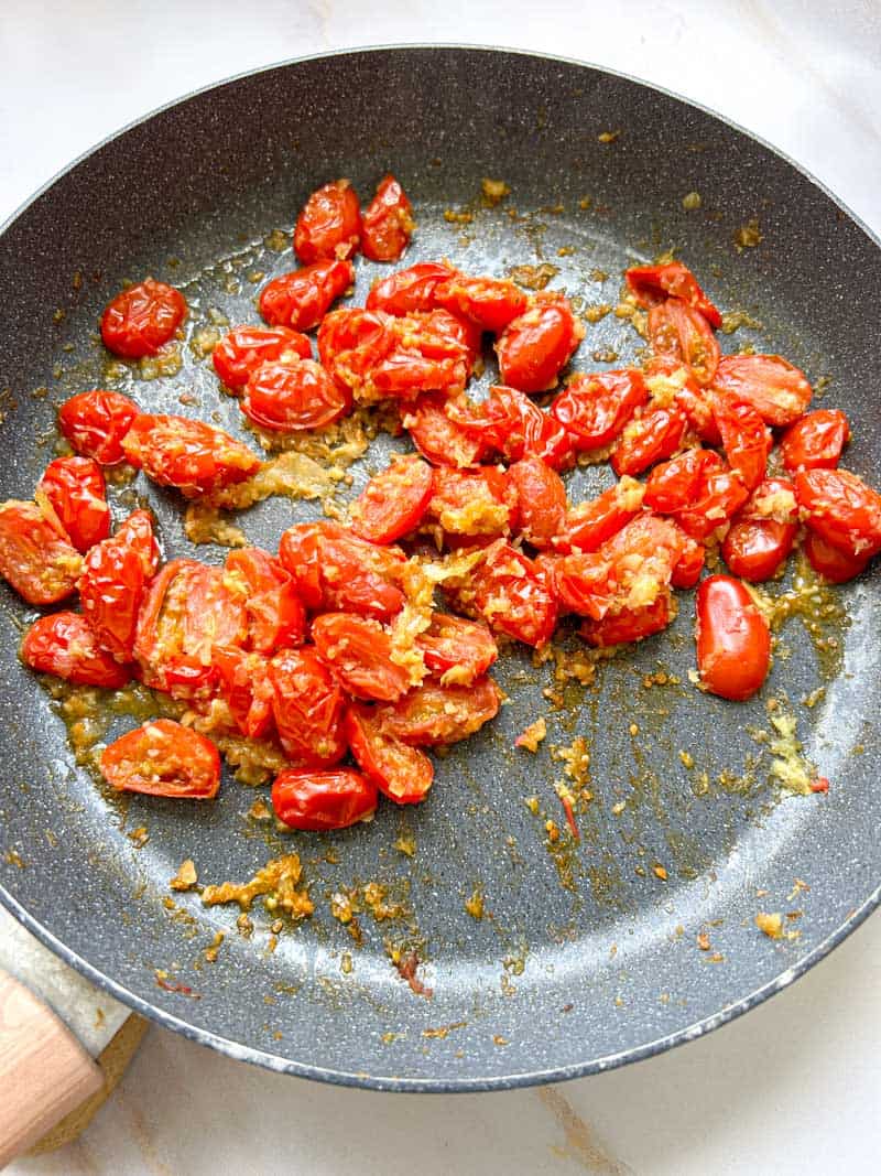 Cherry tomatoes cooked in the frying pan.