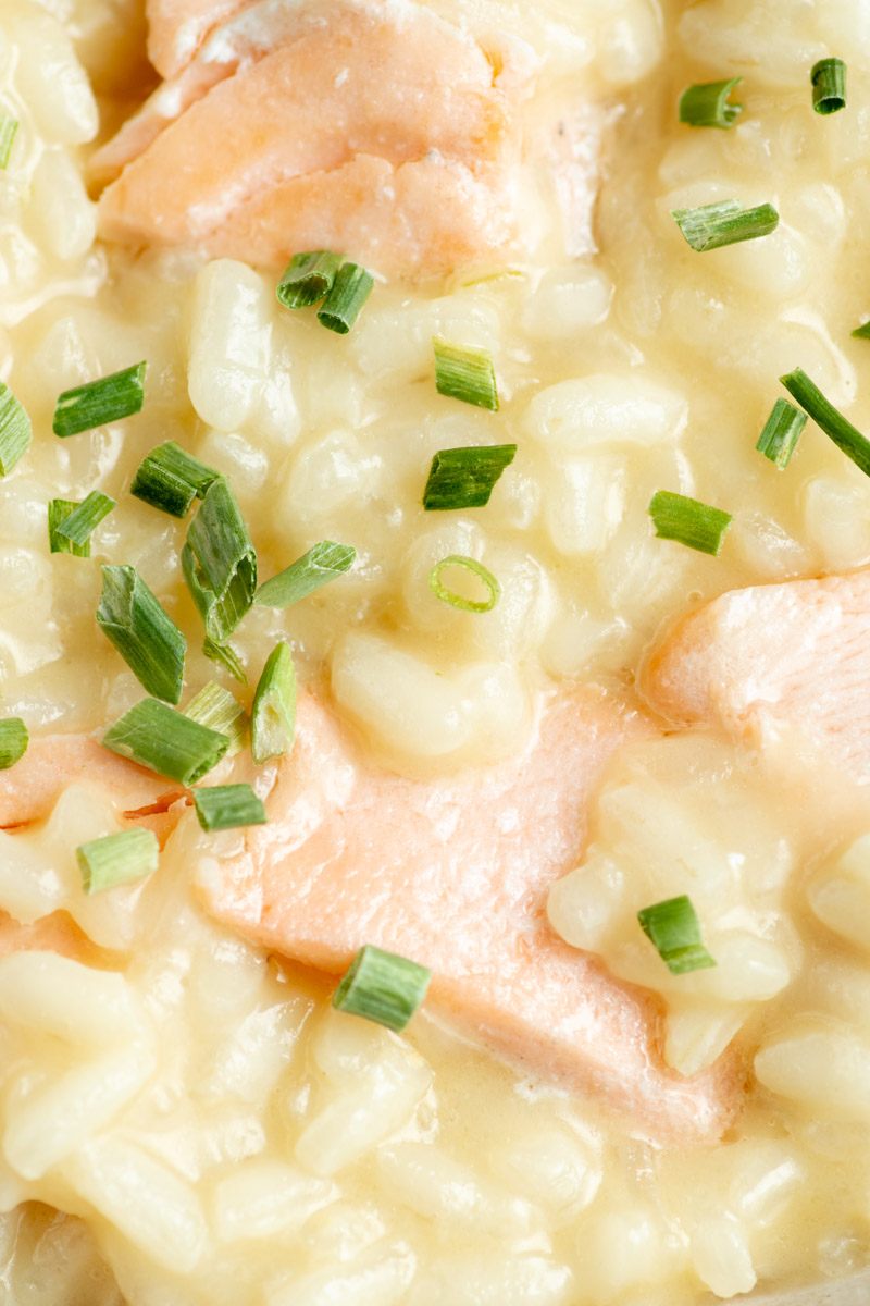 Creamy salmon risotto with chopped chives.