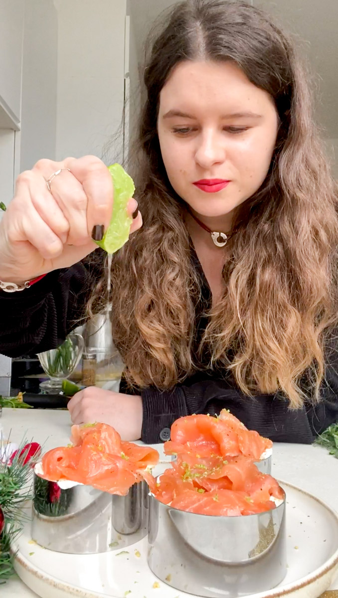 Marie squeezes a lime onto the cookie cutters.
