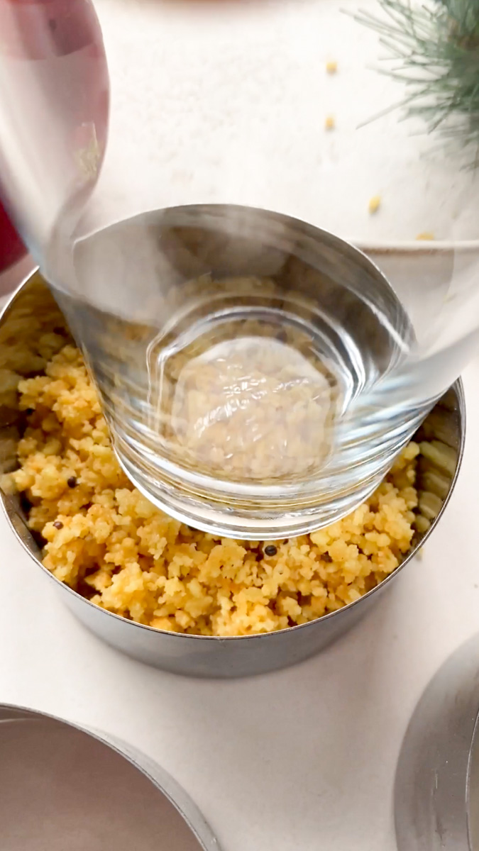 Glass that compacts the savory cracker mixture in the cookie cutter.