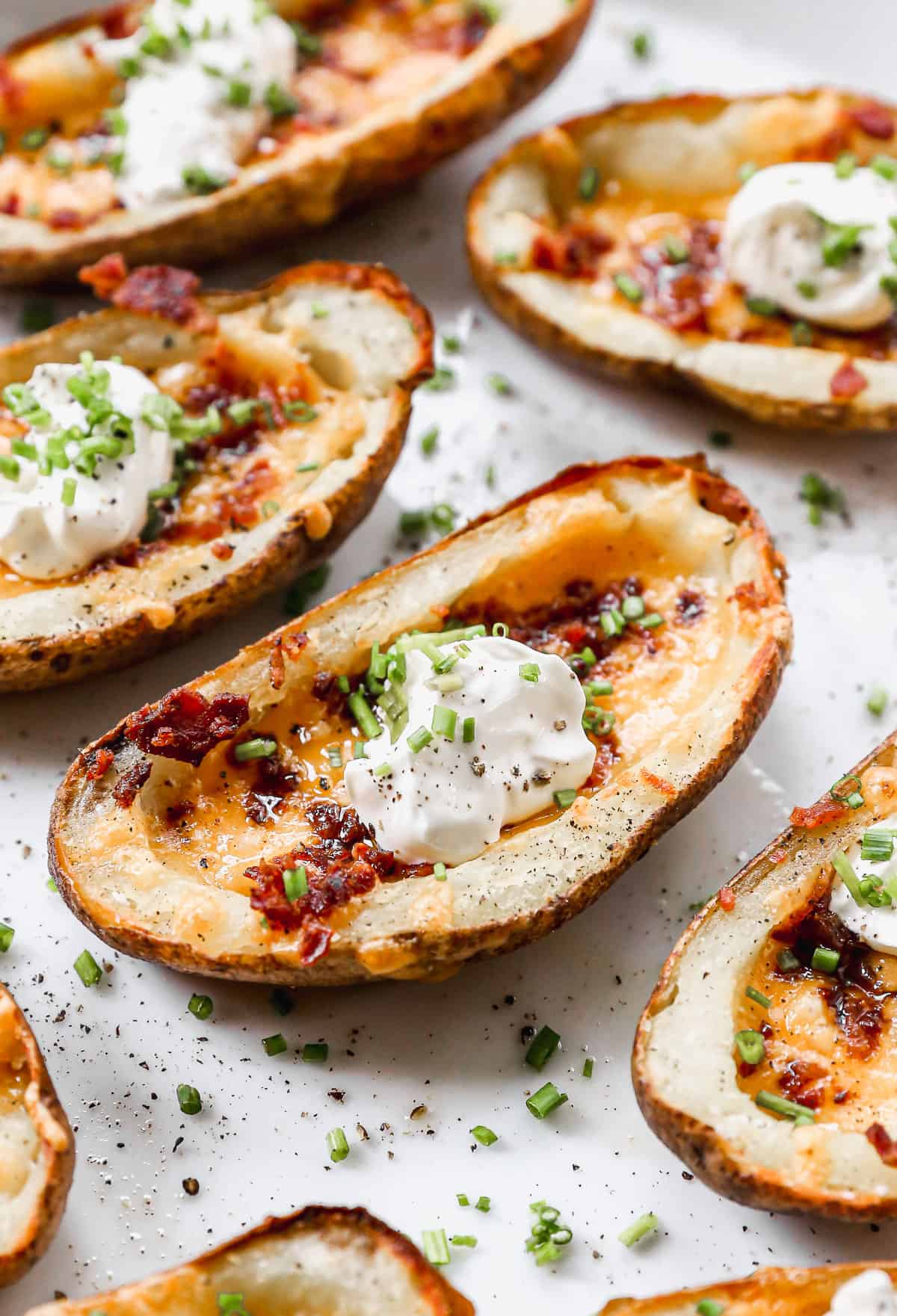 Potato halves filled with chopped bacon, sour cream and chives.
