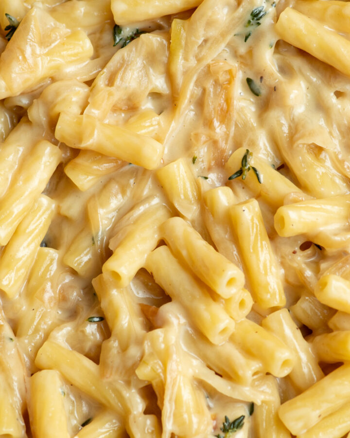 Creamy French onion pasta in a large pan.