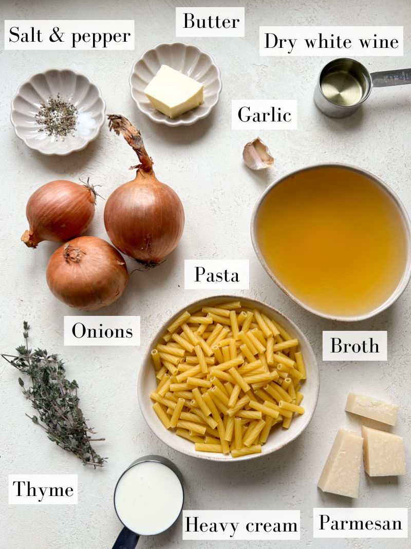 Ingredients of French onion pasta in beige and grey bowls.