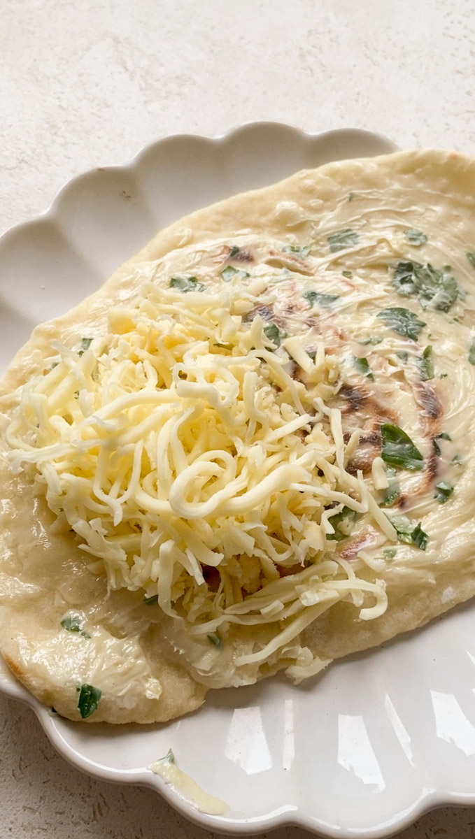 Naan filled with shredded cheeses.