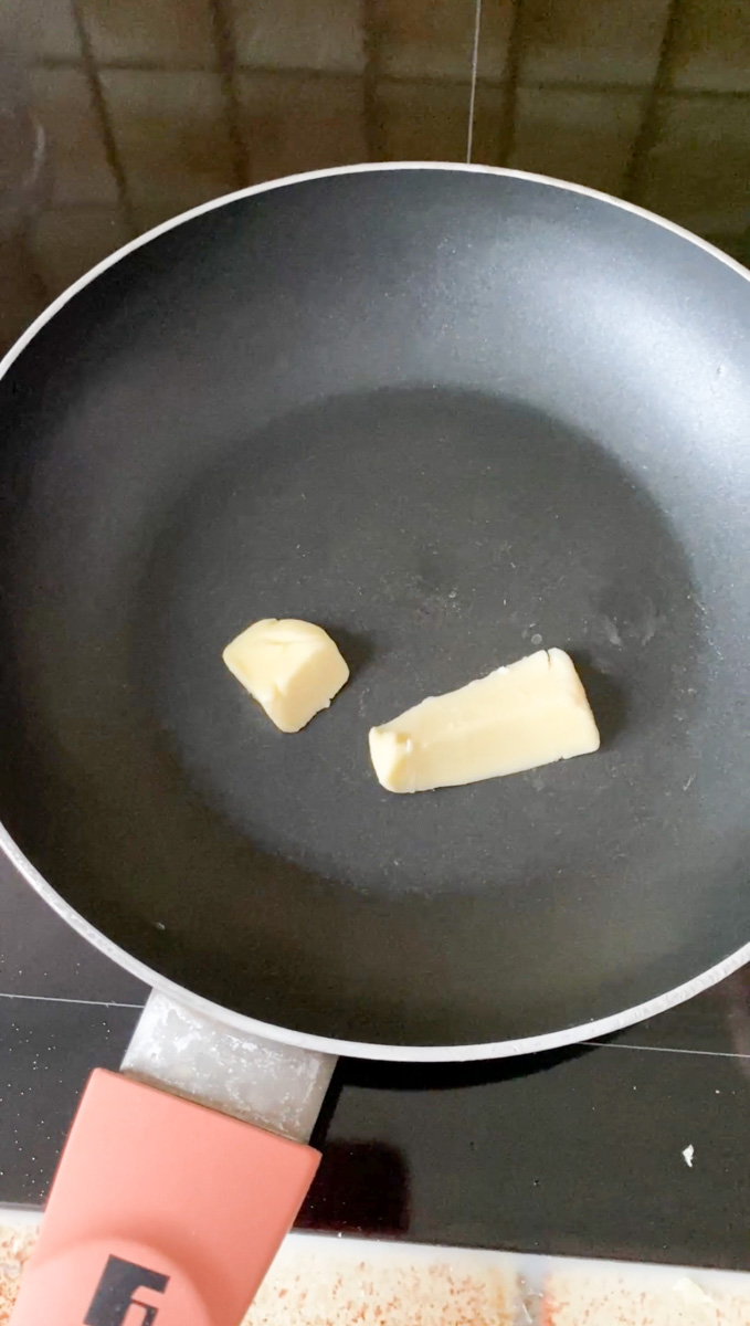 Butter in a small frying pan.