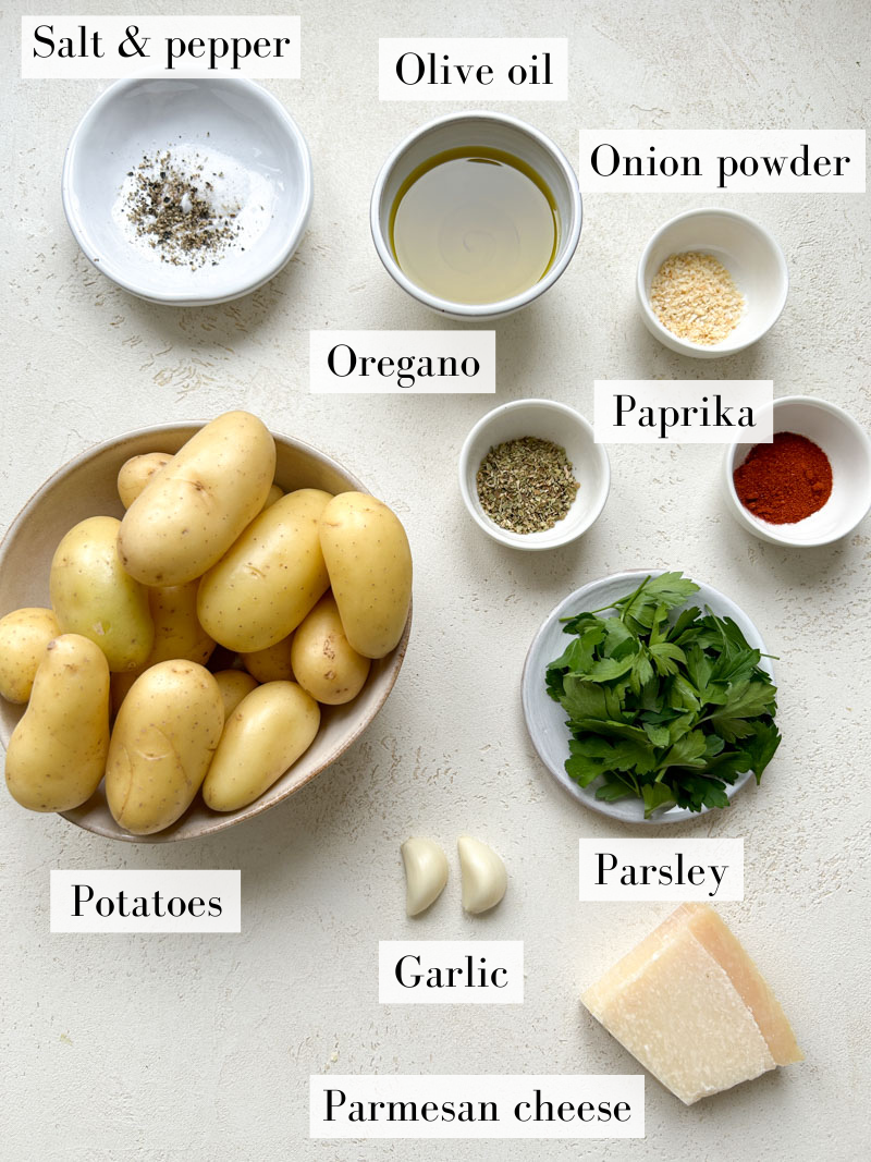 Garlic Parmesan potatoes' ingredients in beige and white bowls.