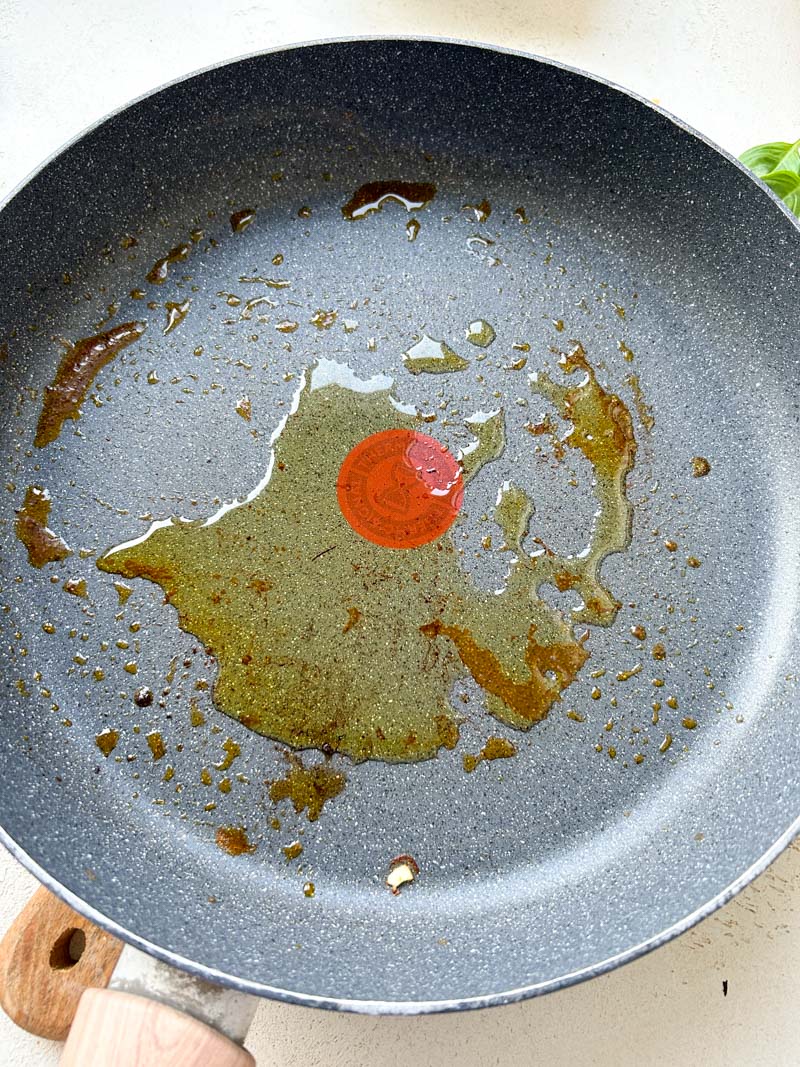Olive oil in a frying pan.