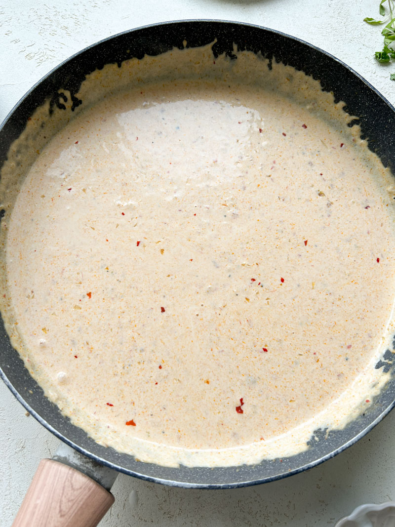 Creamy coconut sauce ready in the pan.