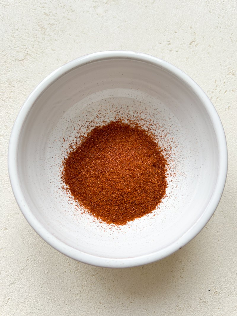 Paprika and Cayenne pepper in a white bowl.
