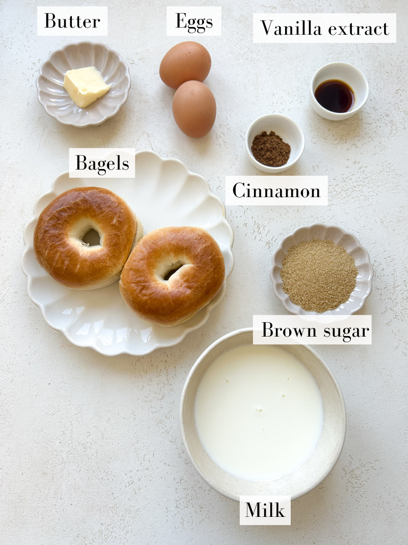 French toast bagels' ingredients in white and beige bowls.