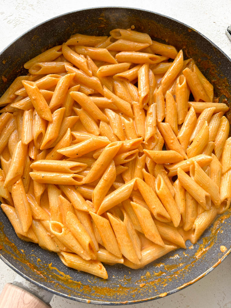 Cooked pasta added to the skillet of creamy Gochujang sauce.