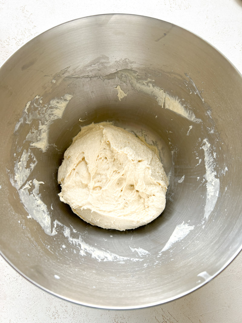 Ball of dough in the large stainless steel bowl, before rising.