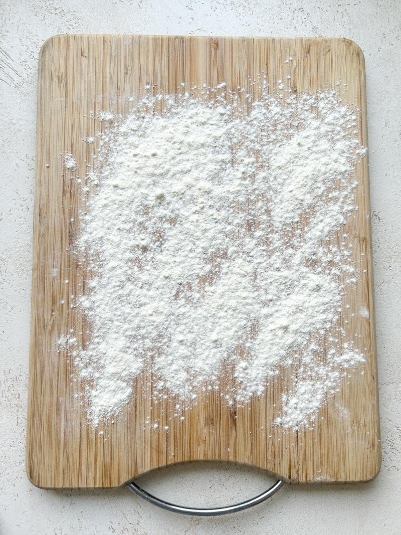 Flour on a wooden board.