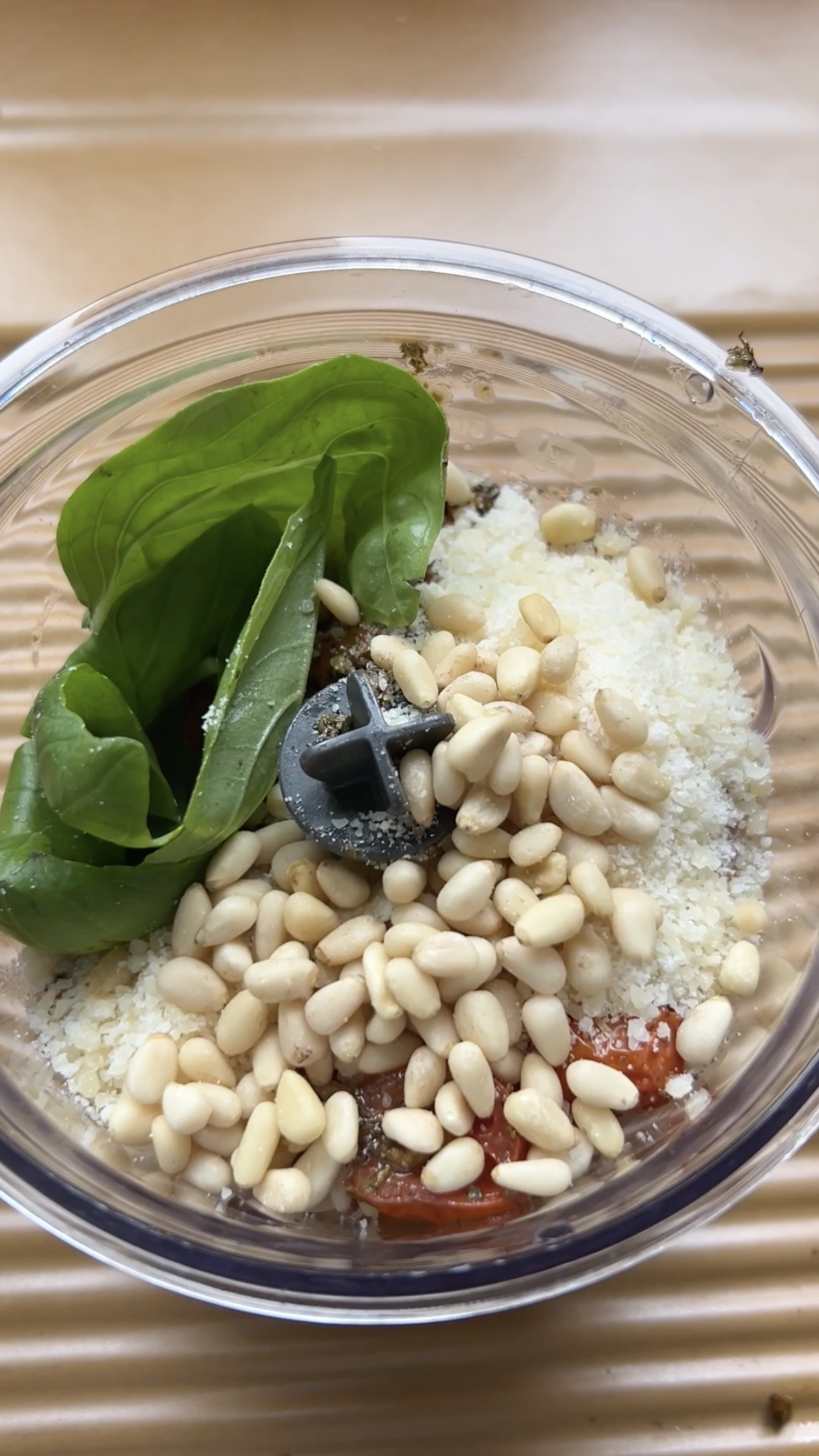 Pine nuts, basil, Parmesan, garlic and cherry tomatoes in a blender.