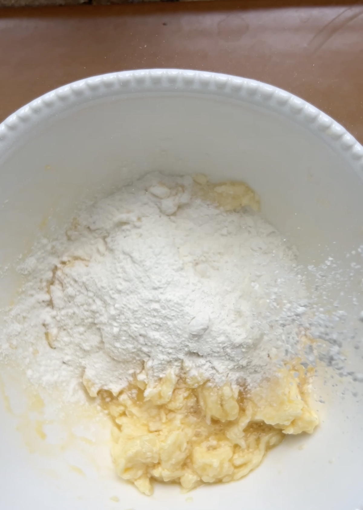 Flour added to a mixture of butter, grated cheeses and egg.