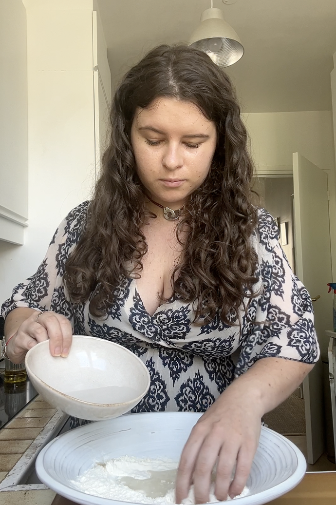 Marie kneading the mixture of flour and water.