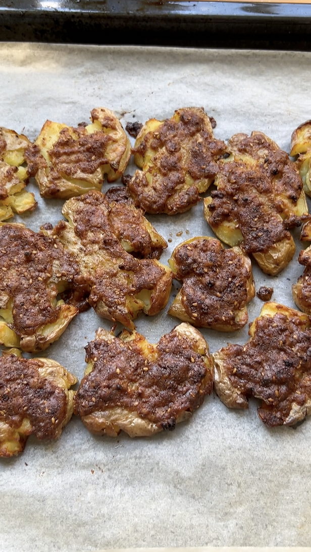 Smashed potatoes, after their second baking in the oven.