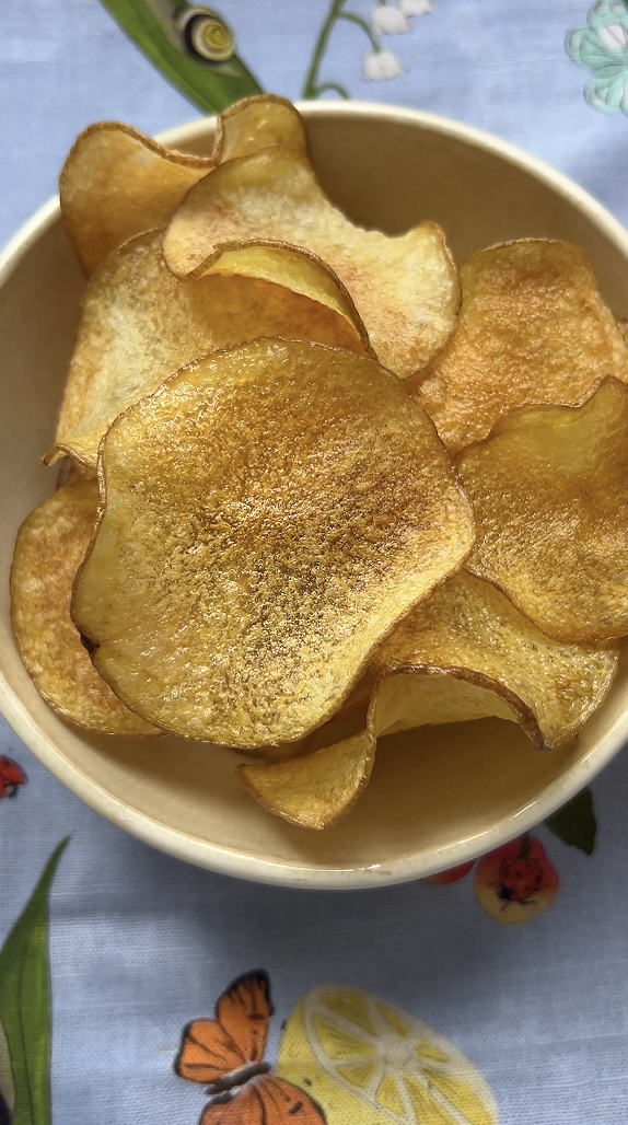 Bowl of crispy, golden baked chips.