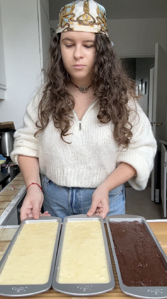 The three sponge cakes in their moulds, before baking.